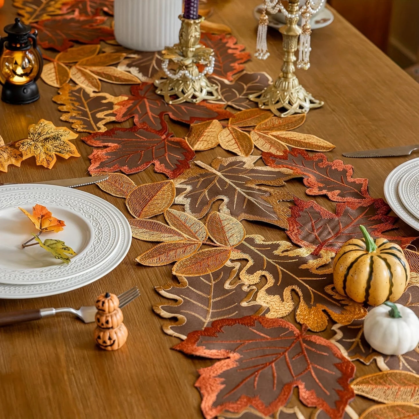 Decorative table setting with leaf-patterned placemats 