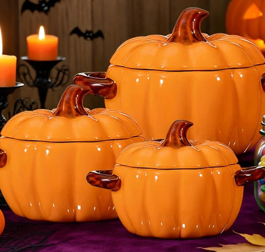 Set of orange pumpkin-shaped canisters with lids.