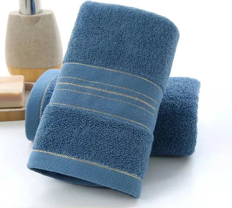 Blue towel with striped edge on a white background