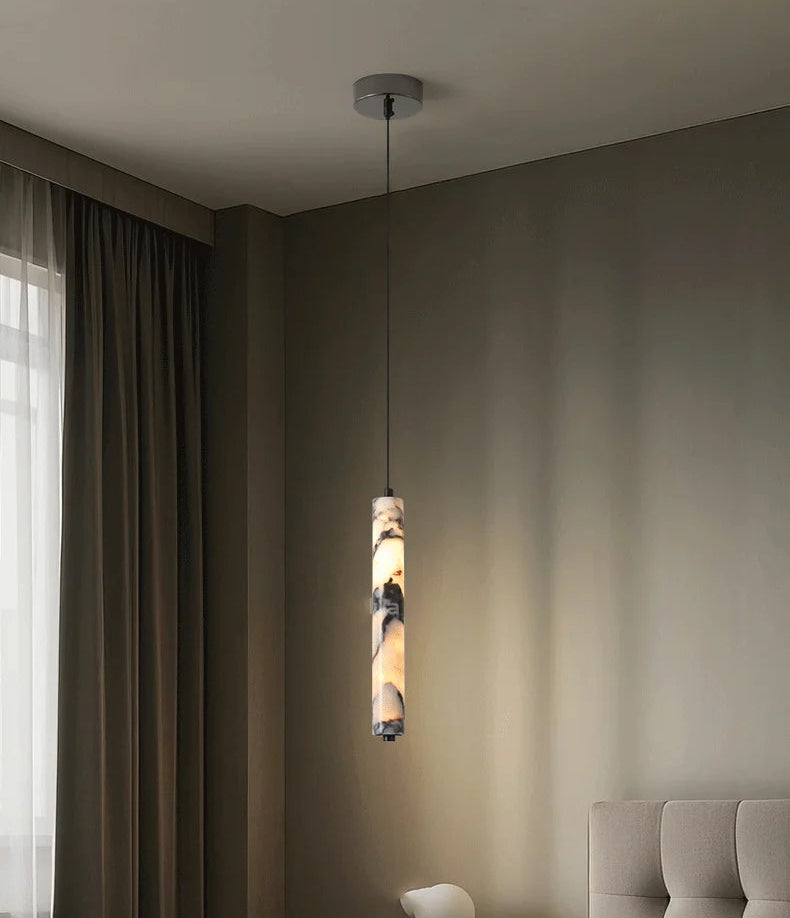 Ceiling lamp in a bedroom setting with a neutral color scheme