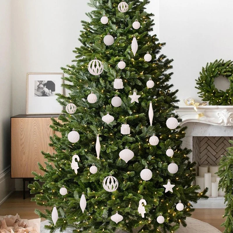 Decorated Christmas tree with white ornaments.