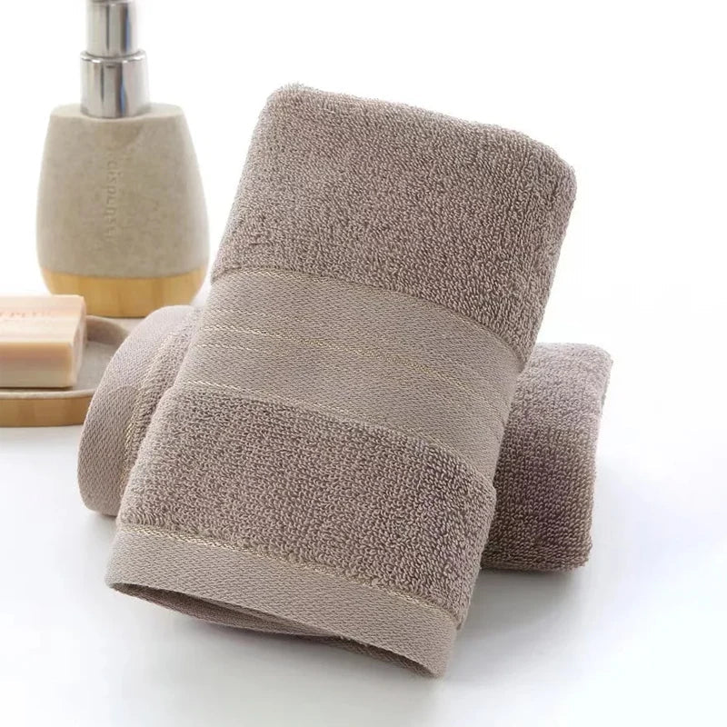 Brown towel with dimensions displayed on a white background