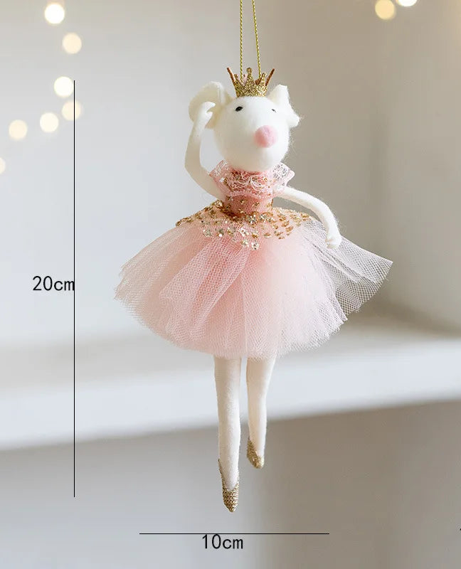 Decorative mouse ornament in a pink dress with gold accents, hanging against a light background.