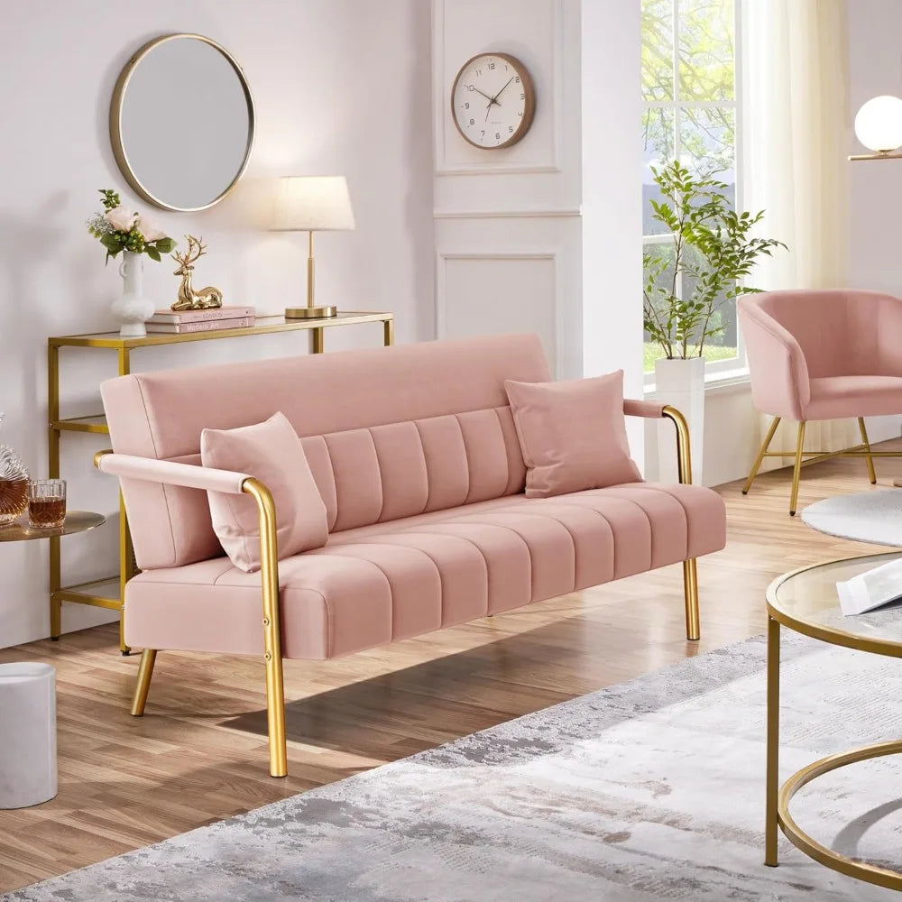Pink sofa with gold legs in a stylish living room setting